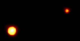 Pluton et Charon pris par le télescope spatial de Hubble le 21 Février 1994 (Courtoisie de la NASA/ESA/ESO) 